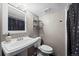 Bathroom features a pedestal sink and walk-in shower at 8901 Field St # 76, Broomfield, CO 80021