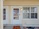 Close-up of the front door entrance with visible house number and welcome mat at 8901 Field St # 76, Broomfield, CO 80021