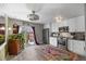 Bright kitchen with stainless steel appliances, white cabinets, and sliding door at 8901 Field St # 76, Broomfield, CO 80021