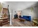 Inviting living room featuring a fireplace, wood floors, and contemporary decor at 8901 Field St # 76, Broomfield, CO 80021