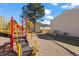 Community playground featuring colorful play structures and a safe, soft landing surface at 8901 Field St # 76, Broomfield, CO 80021