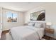 Stylized main bedroom features a soft bed and a neutral-colored painting at 3270 W 134Th Ave, Broomfield, CO 80020