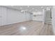 Finished basement featuring LVP flooring and a wet bar with white cabinets at 951 E 10Th Ave, Broomfield, CO 80020