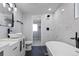 This bathroom features a soaking tub, modern fixtures, and a marble tiled shower at 951 E 10Th Ave, Broomfield, CO 80020