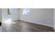 Well-lit bedroom features hardwood floors, white trim and baseboards at 951 E 10Th Ave, Broomfield, CO 80020