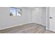 This bedroom features durable floors, bright natural light, and a spacious closet at 951 E 10Th Ave, Broomfield, CO 80020