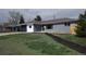 Charming ranch-style home with a well-maintained front yard and attached carport at 951 E 10Th Ave, Broomfield, CO 80020
