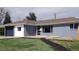 Charming single-story home with a mix of brick and painted finishes and updated landscaping at 951 E 10Th Ave, Broomfield, CO 80020