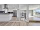 Open-concept kitchen with stainless steel appliances flows into a spacious living area at 951 E 10Th Ave, Broomfield, CO 80020