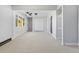 Open living room with new carpet and a lot of natural light at 951 E 10Th Ave, Broomfield, CO 80020