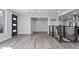 Open-concept space with luxury vinyl plank flooring, modern railing, and a view of other rooms at 951 E 10Th Ave, Broomfield, CO 80020