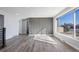 Bright living room with large windows, sleek floors and a contemporary accent wall at 951 E 10Th Ave, Broomfield, CO 80020