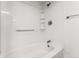 Bathroom with a shower/tub, grab bar, and shelving at 1250 N Humboldt St # 1002, Denver, CO 80218