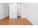 Bedroom with parquet flooring and access to hallway at 1250 N Humboldt St # 1002, Denver, CO 80218