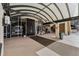 Building entrance with arched canopy and doors at 1250 N Humboldt St # 1002, Denver, CO 80218