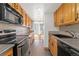 Bright kitchen with stainless steel appliances and wood cabinets at 1250 N Humboldt St # 1002, Denver, CO 80218