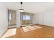 Bright living room with hardwood floors and balcony access at 1250 N Humboldt St # 1002, Denver, CO 80218