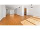 Open concept living room with hardwood floors and kitchen access at 1250 N Humboldt St # 1002, Denver, CO 80218