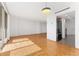 Living room with hardwood floors and kitchen access at 1250 N Humboldt St # 1002, Denver, CO 80218