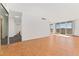 Living room with hardwood floors and access to balcony at 1250 N Humboldt St # 1002, Denver, CO 80218