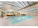 Indoor pool with seating area and arched skylights at 1250 N Humboldt St # 1002, Denver, CO 80218
