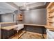 Basement kitchenette with wooden countertops and white sink at 12912 Ironstone Way # 101, Parker, CO 80134