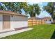Spacious backyard featuring a well-kept lawn and wood fence, perfect for outdoor activities at 4465 N Umatilla St, Denver, CO 80211