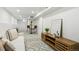Open basement living area, complete with stylish furniture and a modern media center for cozy entertainment at 4465 N Umatilla St, Denver, CO 80211