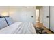 Bright bedroom features fresh white walls, soft bedding, and modern black hardware for a sleek, inviting space at 4465 N Umatilla St, Denver, CO 80211