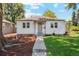Cozy single-story home featuring a welcoming front porch and manicured landscaping at 4465 N Umatilla St, Denver, CO 80211