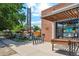 Charming brick building featuring outdoor seating and welcoming entry way at 4465 N Umatilla St, Denver, CO 80211