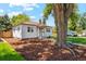 Attractive home with a mature tree and a nicely landscaped front yard at 4465 N Umatilla St, Denver, CO 80211
