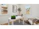 Bright home office with natural light, white desk, and stylish decor creates an inspiring and productive workspace at 4465 N Umatilla St, Denver, CO 80211