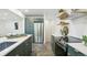 Gourmet kitchen featuring stainless steel appliances, an island, and ample cabinet space at 4465 N Umatilla St, Denver, CO 80211