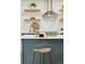 Modern kitchen with a white countertop, wooden shelves and decorative tile backsplash at 4465 N Umatilla St, Denver, CO 80211