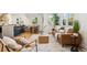 Tastefully furnished living space integrates a kitchen and dining area for seamless entertaining at 4465 N Umatilla St, Denver, CO 80211
