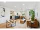 Sun-filled living room seamlessly connects to a modern kitchen and dining area at 4465 N Umatilla St, Denver, CO 80211