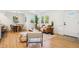 Bright, open-concept living room features hardwood floors and stylish contemporary furnishings at 4465 N Umatilla St, Denver, CO 80211