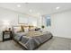 Cozy main bedroom features plush bedding, modern lighting, and a soothing color palette for ultimate relaxation at 4465 N Umatilla St, Denver, CO 80211