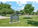 Chaffee Park sign, green grass, and mature trees on a bright day at 4465 N Umatilla St, Denver, CO 80211