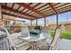 Backyard patio featuring a seating area around a cozy fire pit at 1320 Quari St, Aurora, CO 80011