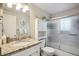 Bathroom featuring a granite countertop with a shower/tub combo with frosted glass at 1320 Quari St, Aurora, CO 80011