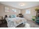 Serene bedroom featuring natural light, comfortable furnishings, and a tranquil ambiance for restful nights at 1320 Quari St, Aurora, CO 80011