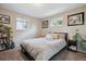 Comfortable bedroom with ample natural light, neutral tones, and stylish decor creates a relaxing retreat at 1320 Quari St, Aurora, CO 80011