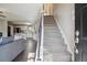 View of the stairway and front door leading to the open kitchen and living room at 1320 Quari St, Aurora, CO 80011
