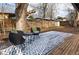 Backyard featuring an outdoor seating area, a wood deck, and a privacy fence at 2435 S Meade St, Denver, CO 80219