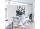 A modern dining room featuring stylish chairs and a round table at 2435 S Meade St, Denver, CO 80219