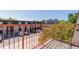 Balcony overlooking city buildings offering a unique view and outdoor enjoyment at 7755 E Quincy Ave # 308A5, Denver, CO 80237