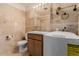 Bathroom featuring a sink, toilet, and washing machine at 7755 E Quincy Ave # 308A5, Denver, CO 80237