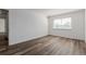 Bright bedroom featuring wood floors and a window for natural light at 7755 E Quincy Ave # 308A5, Denver, CO 80237